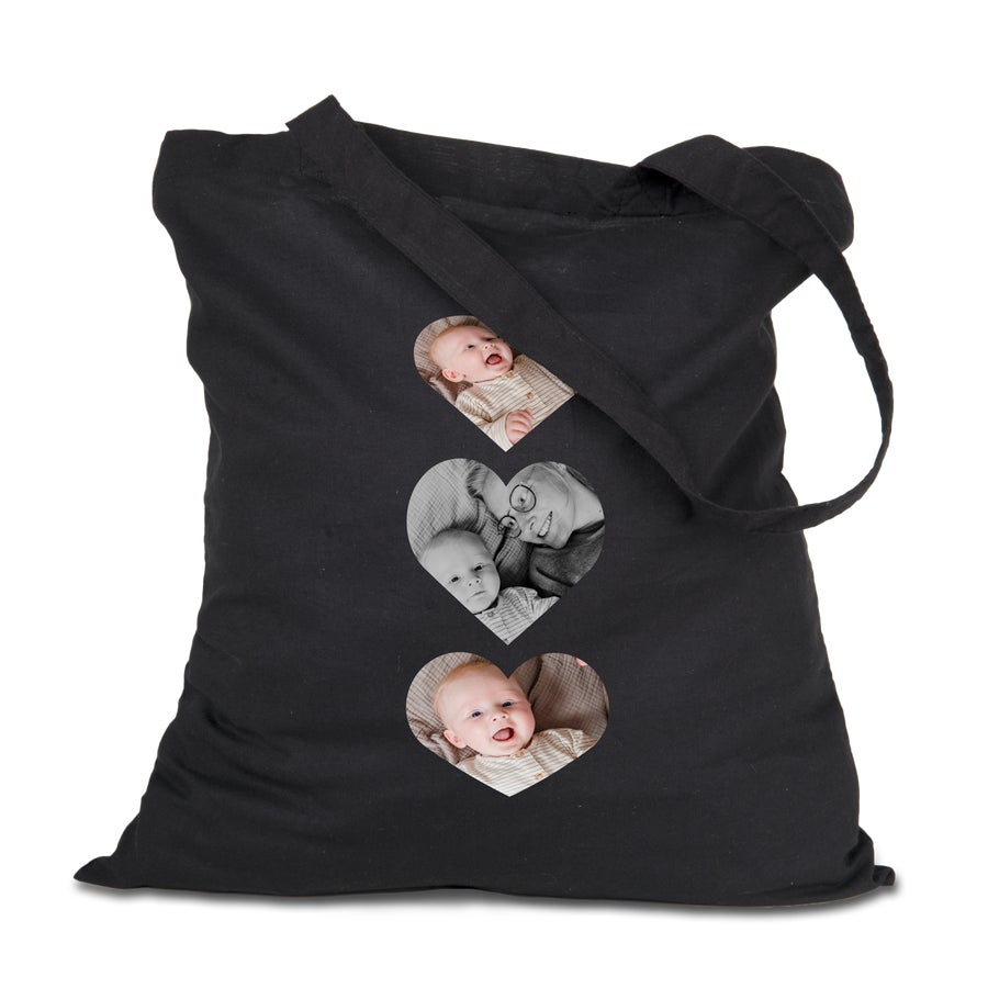 Black canvas tote with three heart-shaped family photos printed in full colour on the front
